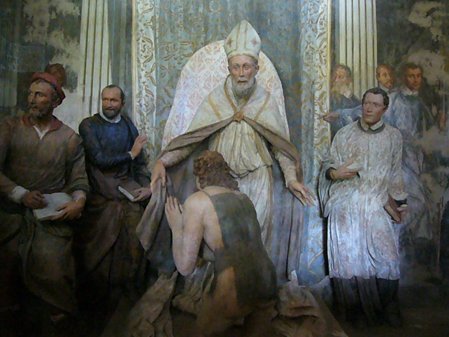 Affresco con vescovo in piviale che accoglie un uomo inginocchiato, circondato da astanti